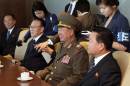 Hwang Pyong So, vice chairman of North Korea's National Defense Commission, center, is flanked by secretaries of North Korea's ruling Workers' Party Choe Ryong Hae, right, and Kim Yang Gon, while attending a luncheon meeting with South Korean officials at a hotel in Incheon, South Korea, Saturday, Oct. 4, 2014. Hwang, North Korea's presumptive No. 2 and other members of Pyongyang's inner circle made a surprise trip Saturday to South Korea for the close of the Asian Games, with the rivals holding their highest level face-to-face talks in five years.(AP Photo/Yonhap, Yun Tae-hyun) KOREA OUT