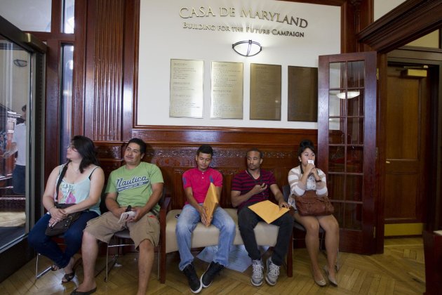 FILE - This Aug. 15, 2012 file photo shows applicants waiting in Casa de Maryland in Langley Park, Md., before they can apply for the Deferred Action Childhood Arrivals, as the U.S. started accepting applications to allow them to avoid deportation and get a work permit _ but not a path to citizenship. More than 6 in 10 Americans now favor allowing illegal immigrants to eventually become U.S. citizens, a major increase in support driven by a turnaround in Republicans' opinion after the 2012 elections. The finding, in a new Associated Press-GfK poll, comes as Republicans seek to increase their meager support among Latino voters, who turned out in large numbers to help-re-elect President Barack Obama in November. (AP Photo/Jose Luis Magana, File)