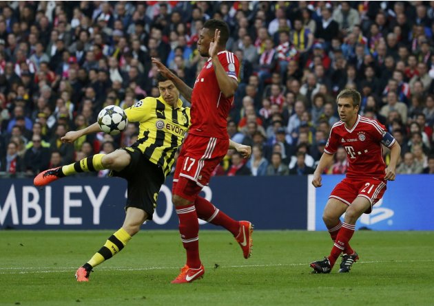 Borussia Dortmund's Robert Lewandowski challenges Bayern Munich's Jerome Boateng during their Champions League Final soccer match at Wembley Stadium in London