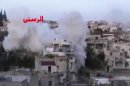 In this image taken from video obtained from the Ugarit News, which has been authenticated based on its contents and other AP reporting, smoke rises from buildings after rockets slammed into them in the rebel-held town of Rastan, Syria, just north of Homs, Friday, Jan. 25, 2013. Regime troops shelled the city of Homs on Friday as soldiers battled rebels around the central province with the same name, which was a major frontline during the first year of the revolt. (AP Photo/Ugarit News via AP video)
