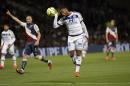Lyon's Alexandre Lacazette heads the ball, during the French League One soccer match between Lyon and Bordeaux, in Lyon, central France, Saturday, May 16, 2015. (AP Photo/Laurent Cipriani)