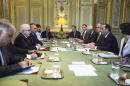 French President Francois Hollande, second right, discusses with his Iraqi counterpart Fouad Massoum, second left, at the Elysee Palace in Paris, France, Monday, Sept. 15 2014. Reconnaissance planes at the ready, Hollande said there was "no time to lose" in the global push to combat extremists from the Islamic State group, minus the two countries who share most of Iraq's borders. (AP Photo/Etienne Laurent, Pool)