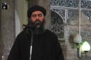 An image grab from a video released on July 5, 2014 by al-Furqan Media is said to show Abu Bakr al-Baghdadi addressing Muslim worshippers at a mosque in Mosul