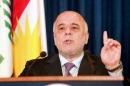 Abadi attends a news conference in Arbil