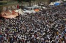 Supporters of ousted President Mohamed Mursi perform the weekly Friday prayers at Rabaa Adawiya square where they are camping, in Cairo