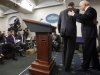 President Barack Obama and Vice President Joe Biden leave the podium after Obama made a statement regarding the passage of the fiscal cliff bill in the Brady Press Briefing Room at the White House in Washington, Tuesday, Jan. 1, 2013. (AP Photo/Charles Dharapak)