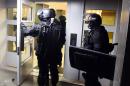 France carries out raids, names more potential attackers