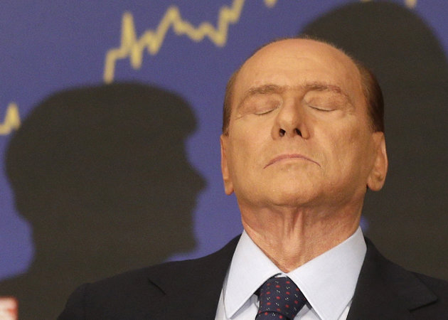 FILE - In this Sept. 27, 2012 file photo, Italian former premier Silvio Berlusconi reacts during a press conference in Rome, Italy. A court in Italy has convicted, Friday, Oct. 26, 2012, former Premier Silvio Berlusconi of tax fraud and sentenced him to four years in prison. In Italy, cases must pass two levels of appeal
   before
 the verdicts are final. Berlusconi is expected to
 appeal. (AP Photo/Alessandra Tarantino, File)