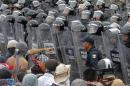 Demonstrators confront riot police during a protest against the suspected massacre of 43 missing Mexican students, near Acapulco's airport on November 10, 2014