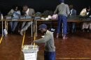 A Zimbabwean policeman casts his vote in the capital Harare