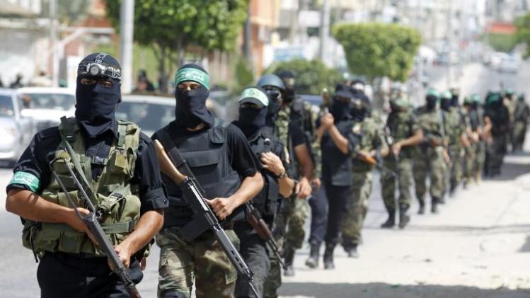 Palestinian militants of the Ezzedine al-Qassam Brigades, Hamas's armed wing, parade in Rafah, southern Gaza Strip, on May 29, 2014