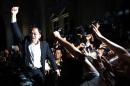Malaysian opposition leader Anwar Ibrahim shouts to his supporters at a court house in Putrajaya