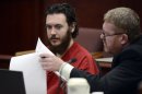 Defense Attorney Daniel King, right, and Aurora theater shooting suspect James Holmes review advisement documents in court in Centennial, Colo., on Tuesday, June 4, 2013. Holmes was allowed to change his plea to not guilty by reason of insanity. (AP Photo/The Denver Post, Andy Cross, Pool)