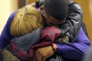 Ma'lik Richmond, 16, top, hugs his mother Daphne Birden, after closing arguments were made on the fourth day of the juvenile trial he and co-defendant Trent Mays, 17, on rape charges in juvenile court on Saturday, March 16, 2013 in Steubenville, Ohio. Mays and Richmond are accused of raping a 16-year-old West Virginia girl in August, 2012. Judge Thomas Lipps said he would render a decision on Sunday morning, March 17. (AP Photo/Keith Srakocic, Pool)