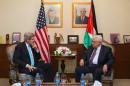 US Secretary of State John Kerry (L) meets with Palestinian president Mahmud Abbas (R) in Amman, on March 26, 2014