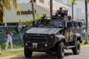 State police patrol during a security operation in Puerto Vallarta in the western Mexican state of Jalisco after the son of drug lord Joaquin "El Chapo" Guzman was kidnapped