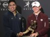 Notre Dame linebacker Manti Te'o, left, and Texas A&M quarterback Johnny Manziel, two of the three Heisman Trophy finalists, pose with the Heisman Trophy during a media availability, Friday, Dec. 7, 2012 in New York.  (AP Photo/Mary Altaffer)