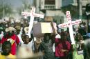 Demonstrators march during a protest against the government of President Michel Martelly in Port-au-Prince, on December 12, 2014