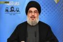 An image grab from Hezbollah's al-Manar TV shows Hassan Nasrallah, the head of Lebanon's militant Shiite Muslim movement Hezbollah, giving a televised address from an undisclosed location on February 16, 2014 in Lebanon