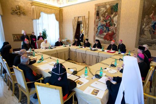 This handout picture released on November 21, 2013 by the Vatican press office shows Pope Francis during a meeting with Patriarchs and Major Archbishops of the Eastern Churches for Syria, Iraq and the Middle East at the Vatican