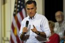 Republican presidential candidate Romney talks to supporters during a campaign rally in St. Petersburg, Florida