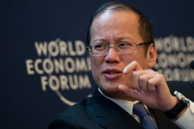 Philippine President Benigno Aquino attends a session of the World Economic Forum at the Swiss resort of Davos, on January 25, 2013. Aquino has welcomed the US Navy's apology for a minesweeper that went aground on a World Heritage-listed coral reef, but said they would not be exempt from penalties