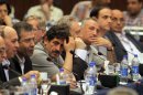Exiled Syrian opposition figures meet in New Cairo, Egypt, Tuesday, July 3, 2012. The Arab League chief urged exiled Syrian opposition figures to unite at a meeting as a new Western effort to force President Bashar Assad from power faltered. (AP Photo/Amr Nabil)