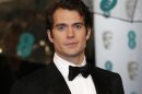 Henry Cavill poses as he arrives for the British Academy of Film and Arts (BAFTA) awards ceremony at the Royal Opera House in London