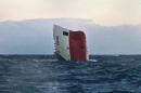 The upturned hull of cargo vessel Cemfjord pictured in the sea 15 miles from Wick in northeast Scotland on January 3, 2015