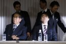 Japan Restoration Party leader and nationalist former Tokyo Governor Shintaro Ishihara and his deputy, Osaka Mayor Toru Hashimoto take their seats at a joint news conference to unveil their campaigning platform in Tokyo