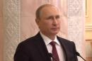 Putin, Poroshenko shake on ceasefire