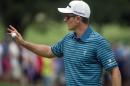 Justin Rose, of England, reacts after making a birdie on the first hole during the third round of the Bridgestone Invitational golf tournament in Akron, Ohio, Saturday, Aug. 8, 2015. (AP Photo/Phil Long)