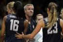 United States head coach Karch Kiraly, center, meets with members of the team during a women's preliminary volleyball match against China at the 2016 Summer Olympics in Rio de Janeiro, Brazil, Sunday, Aug. 14, 2016. (AP Photo/Matt Rourke)