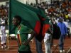 Zambia's Emmanuel Mayuka runs with Zambia flag as he celebrates their victory in the African Nations Cup final against Ivory Coast in Libreville