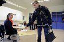 A woman casts her vote during Iceland's general elections in Reykjavik
