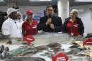 Venezuela's President Hugo Chavez (C) speaks during the opening of a state-run Bicentenario supermarket in Caracas