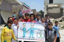 In this citizen journalism image provided by Edlib News Network, ENN, which has been authenticated based on its contents and other AP reporting, anti-Syrian regime protesters hold a poster depicting Syrian President Bashar Assad, left, and Russian Foreign Minister Sergei Lavrov, right, during a demonstration, at Kafr Nabil town, in Idlib province, northern Syria, Friday May 10, 2013. Arabic banner on the background reads, "Kafr Nabil." (AP Photo/Edlib News Network ENN)