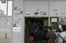 People line up at an employment office in Badalona, near Barcelona, April 25, 2013