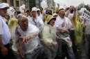 Protesters throw eggs at a portrait of Taiwan's President Ma Ying-jeou on his inauguration day, denouncing his policies, Sunday, May 20, 2012 in Taipei, Taiwan. Despite Ma's re-election in January, the island is greatly divided on his political and economic policies. (AP Photo/Wally Santana)