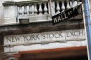 A Wall Street sign is seen in front of the New York Stock Exchange in New York's financial district, March 4, 2013. REUTERS/Brendan McDermid
