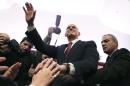 Former Greek Prime Minister George Papandreou waves to a crowd of supporters gathered in Athens, on Saturday Jan. 3, 2015. Papandreou announced the formation of a new party, the Movement of Democrat Socialists, which will contest the Jan. 25 election.(AP Photo/Petros Giannakouris)