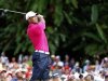 Woods of the U.S. tees off on the first hole during the third round of Malaysia's Asia Pacific Classic golf tournament in Kuala Lumpu