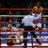 Britain's David Haye looks down at opponent Dereck Chisora after scoring a fifth round knockout in their fight for the vacant WBO and WBA International Heavyweight Championship at Upton Park in London