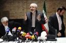 Iranian Foreign Minister Mohammad Javad Zarif and diplomats leave a news conference in Vienna