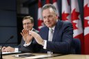 Bank of Canada Governor Poloz speaks during a news conference with Senior Deputy Governor Macklem upon the release of the Monetary Policy Report in Ottawa