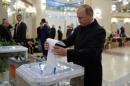 Russian President Putin casts ballot at polling station during parliamentary election in Moscow
