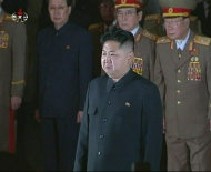 New North Korean ruler Kim Jong-un (front) pays his respects to his father and former leader Kim Jong-il, lying in state at the Kumsusan Memorial Palace in Pyongyang in this still picture taken from video footage aired by KRT (Korean Central TV of the North) December 20, 2011. North Korea was in seclusion on Tuesday, a day after it announced the death of its leader Kim Jong-il, as concern mounted over what would happen next in the deeply secretive nation that is trying to build a nuclear arsenal.   REUTERS/KRT via REUTERS TV  (NORTH KOREA - Tags: OBITUARY POLITICS TPX IMAGES OF THE DAY) FOR EDITORIAL USE ONLY. NOT FOR SALE FOR MARKETING OR ADVERTISING CAMPAIGNS