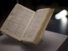 A copy of the "Complete Works of Shakespeare" is displayed and signed by Nelson Mandela and owned by Sonny Venkatrathnam, who was imprisoned on Robben Island in South Africa, during the press view of the "Shakespeare: staging the world" exhibition at the British Museum in London, Wednesday, July 18, 2012. The exhibition, which is being held as part of the London 2012 cultural Olympiad, provides a unique insight into the emerging role of London as a world city 400 years ago, seen through the innovative perspective of Shakespeare's plays.  It runs from July 19 to November 25. (AP Photo/Matt Dunham)