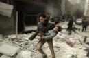 A man runs as he carries a child who survived from what activists say was an airstrike by forces loyal to Syrian President Bashar al-Assad, at al-Ferdaws in Aleppo