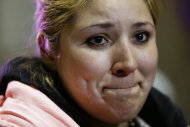 Maria Hernandez, of Angleton, Texas, a passenger from the disabled Carnival Triumph cruise ship, tears up as she describes the ordeal to reporters after arriving by bus at the Hilton Riverside Hotel in New Orleans, Friday, Feb. 15, 2013. The ship had been idled for nearly a week in the Gulf of Mexico following an engine room fire. (AP Photo/Gerald Herbert)